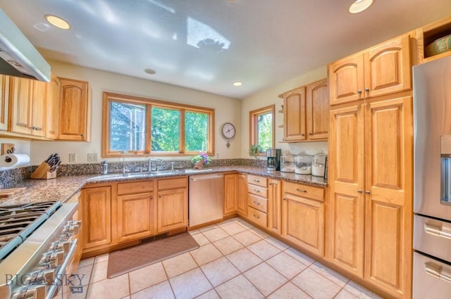 886 Wierda Way, Manhattan, MT 59741 - kitchen with appliances with stainless steel finishes, range hood, dark stone counters, light tile patterned floors, and recessed lighting