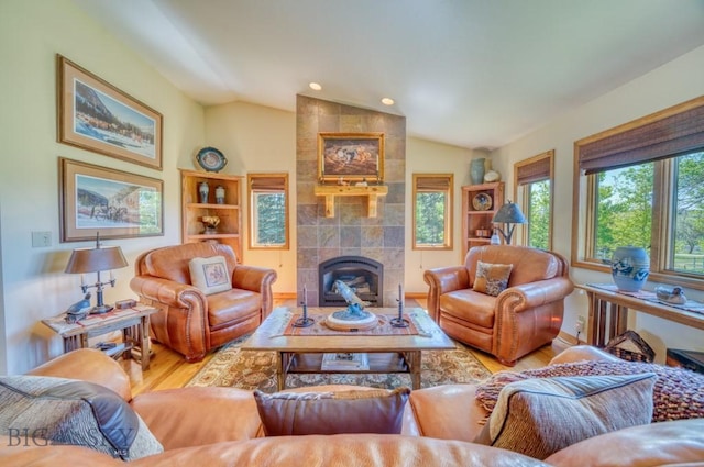 886 Wierda Way, Manhattan, MT 59741 - living room with wood finished floors, lofted ceiling, a tile fireplace, and recessed lighting