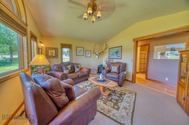 886 Wierda Way, Manhattan, MT 59741 - living area with plenty of natural light, vaulted ceiling, ceiling fan, and carpet