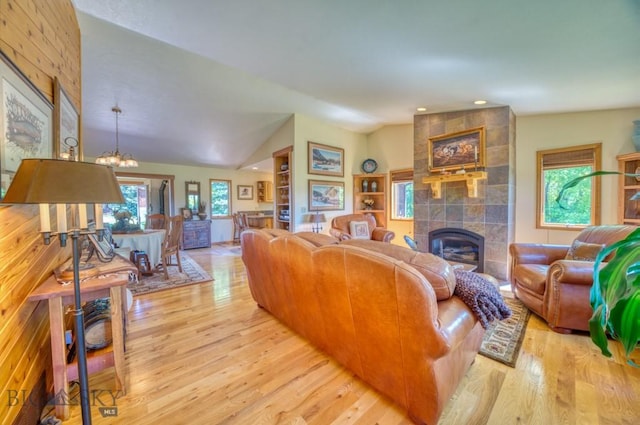 886 Wierda Way, Manhattan, MT 59741 - living area featuring light wood-style floors, a chandelier, a fireplace, lofted ceiling, and recessed lighting