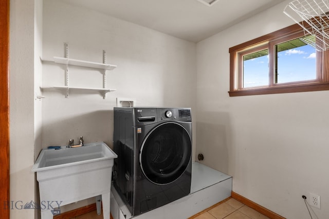 6385 Mt Highway 41, Whitehall, MT 59759 - laundry room featuring washer / dryer and light tile patterned floors