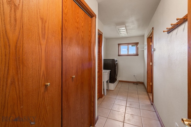 6385 Mt Highway 41, Whitehall, MT 59759 - laundry room featuring separate washer and dryer and light tile patterned flooring