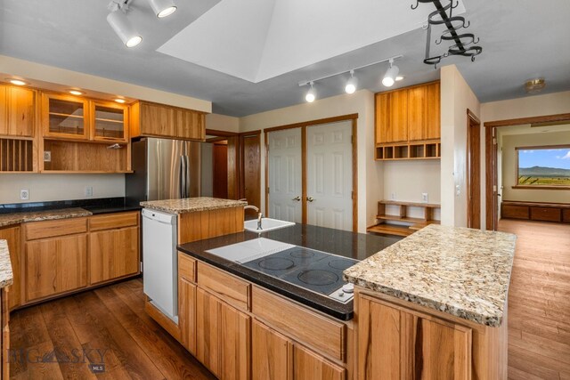 6385 Mt Highway 41, Whitehall, MT 59759 - kitchen with freestanding refrigerator, open shelves, white dishwasher, dark wood-style floors, and electric cooktop
