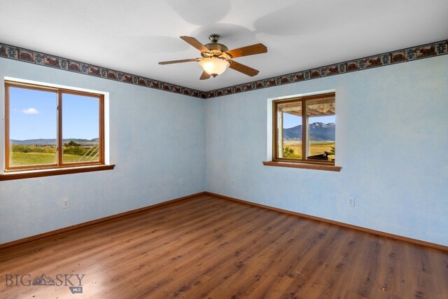 6385 Mt Highway 41, Whitehall, MT 59759 - empty room featuring wood finished floors and a ceiling fan