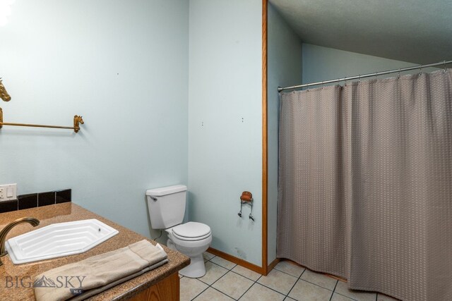 6385 Mt Highway 41, Whitehall, MT 59759 - bathroom with vanity, tile patterned floors, lofted ceiling, and a shower with shower curtain