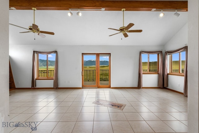 6385 Mt Highway 41, Whitehall, MT 59759 - spare room featuring rail lighting, lofted ceiling, a ceiling fan, and healthy amount of natural light