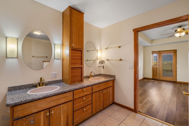 6385 Mt Highway 41, Whitehall, MT 59759 - full bathroom with double vanity, a ceiling fan, and tile patterned floors