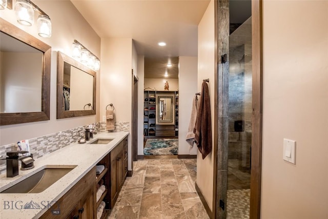 8 Sunset Ct, Ennis, MT 59729 - full bathroom featuring double vanity, a tile shower, recessed lighting, and a spacious closet