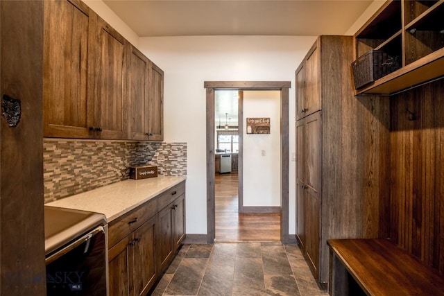 8 Sunset Ct, Ennis, MT 59729 - laundry room with stone finish flooring and cabinet space