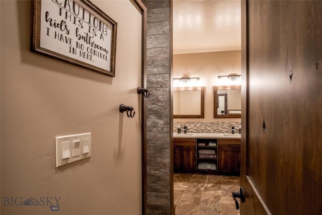 8 Sunset Ct, Ennis, MT 59729 - bathroom featuring double vanity and marble look tiles