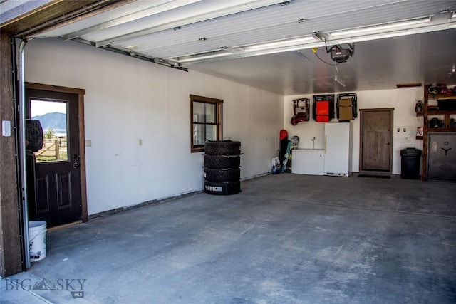 8 Sunset Ct, Ennis, MT 59729 - garage featuring a garage door opener