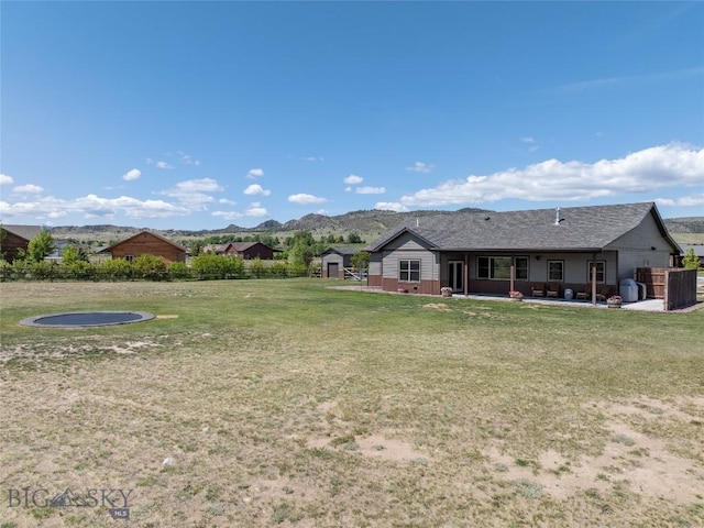 8 Sunset Ct, Ennis, MT 59729 - view of yard featuring a patio area, a storage unit, and a mountain view