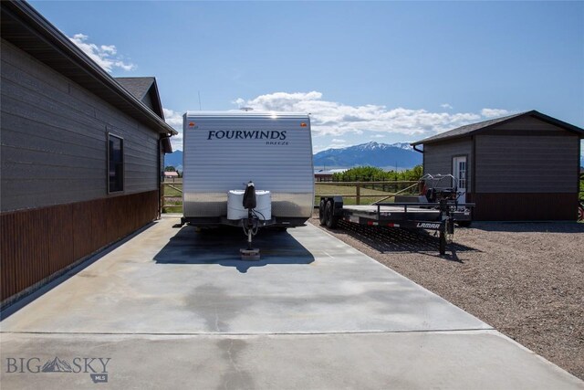 8 Sunset Ct, Ennis, MT 59729 - view of patio with a mountain view and a shed