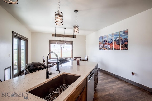 8 Sunset Ct, Ennis, MT 59729 - kitchen featuring dishwasher, plenty of natural light, dark wood finished floors, and light stone counters