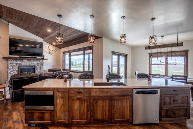 8 Sunset Ct, Ennis, MT 59729 - kitchen with dishwasher, open floor plan, dark wood-type flooring, light countertops, and vaulted ceiling