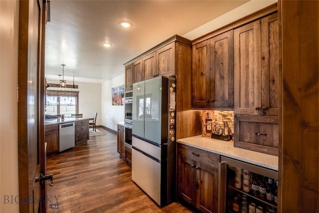 8 Sunset Ct, Ennis, MT 59729 - kitchen featuring stainless steel appliances, wine cooler, dark wood finished floors, recessed lighting, and light stone counters