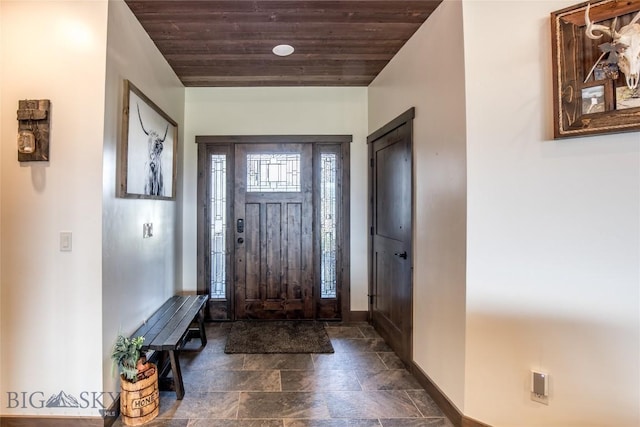 8 Sunset Ct, Ennis, MT 59729 - entryway featuring wood ceiling and dark stone finish floors