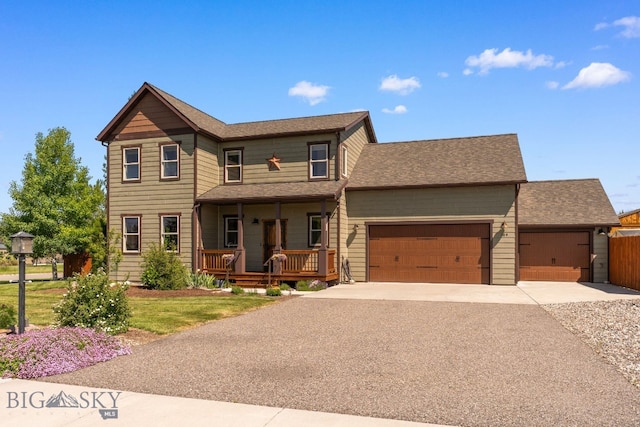 109 Baker St, Belgrade, MT 59714 - view of front of home with covered porch, driveway, a garage, and a shingled roof