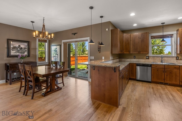 109 Baker St, Belgrade, MT 59714 - kitchen featuring dishwasher, brown cabinets, a peninsula, light wood-style flooring, and recessed lighting