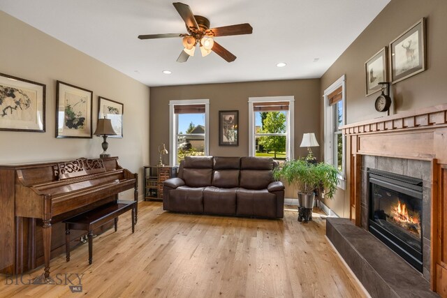 109 Baker St, Belgrade, MT 59714 - living area with a fireplace, a ceiling fan, light wood-style flooring, and recessed lighting