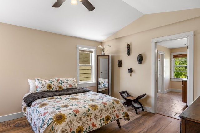 109 Baker St, Belgrade, MT 59714 - bedroom with vaulted ceiling, wood finished floors, and a ceiling fan