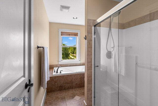 109 Baker St, Belgrade, MT 59714 - full bath with a shower stall, tile patterned flooring, a bath, and recessed lighting
