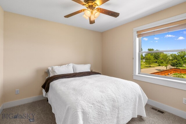 109 Baker St, Belgrade, MT 59714 - carpeted bedroom with baseboards and a ceiling fan