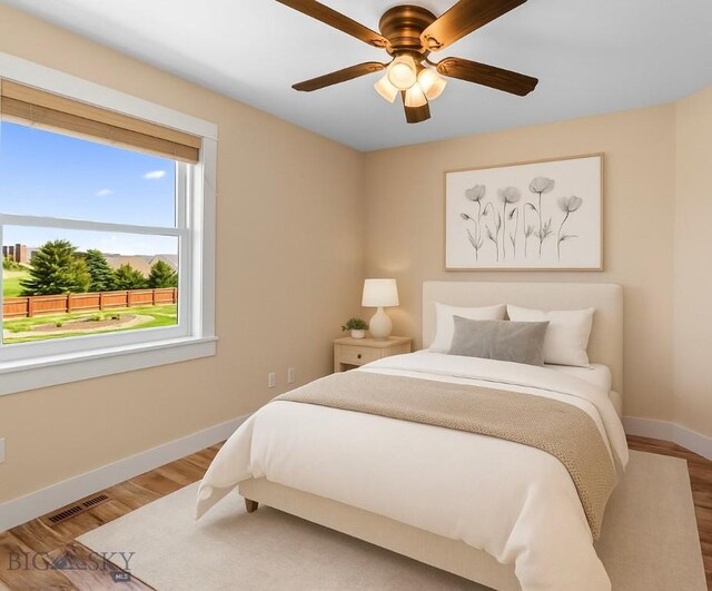 109 Baker St, Belgrade, MT 59714 - bedroom with wood finished floors and a ceiling fan