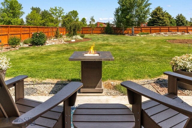 109 Baker St, Belgrade, MT 59714 - fenced backyard with a fire pit