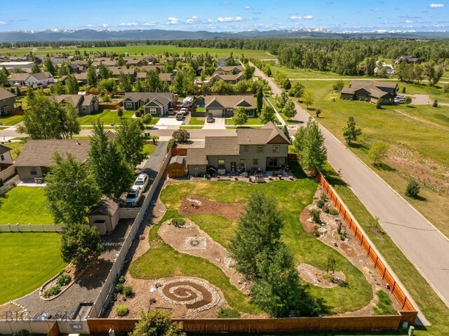 109 Baker St, Belgrade, MT 59714 - aerial perspective of suburban area with a mountainous background