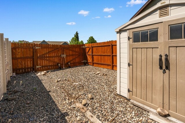 109 Baker St, Belgrade, MT 59714 - fenced backyard with a gate and a shed