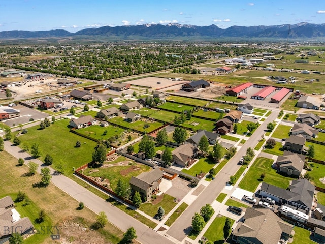 109 Baker St, Belgrade, MT 59714 - aerial perspective of suburban area with a mountain backdrop