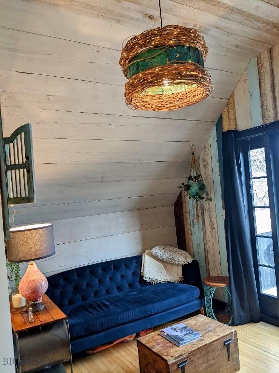 401 S Bozeman Ave, Bozeman, MT 59715 - living area featuring lofted ceiling, wooden walls, hardwood / wood-style flooring, and wooden ceiling