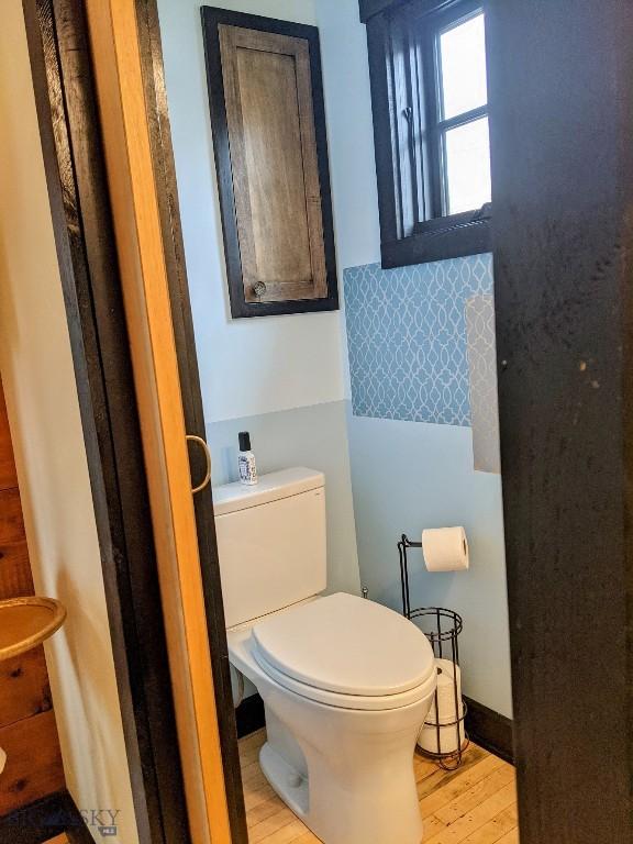 401 S Bozeman Ave, Bozeman, MT 59715 - bathroom featuring wood finished floors and toilet