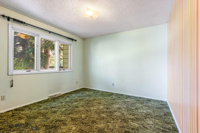 117 Henderson St, Bozeman, MT 59715 - spare room with dark carpet and a textured ceiling