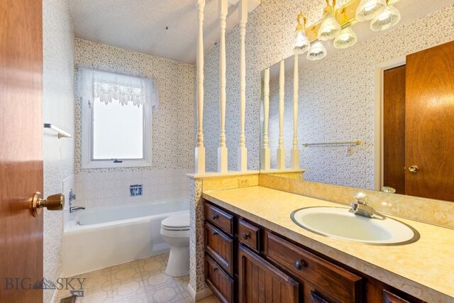 117 Henderson St, Bozeman, MT 59715 - bathroom featuring vanity, a bathtub, and wallpapered walls