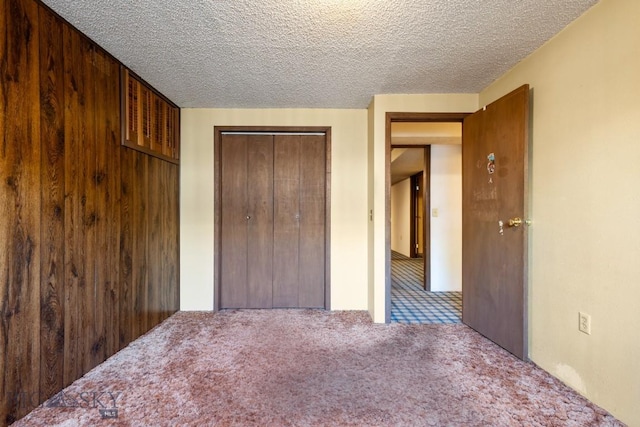 117 Henderson St, Bozeman, MT 59715 - unfurnished bedroom featuring carpet floors, a closet, and a textured ceiling