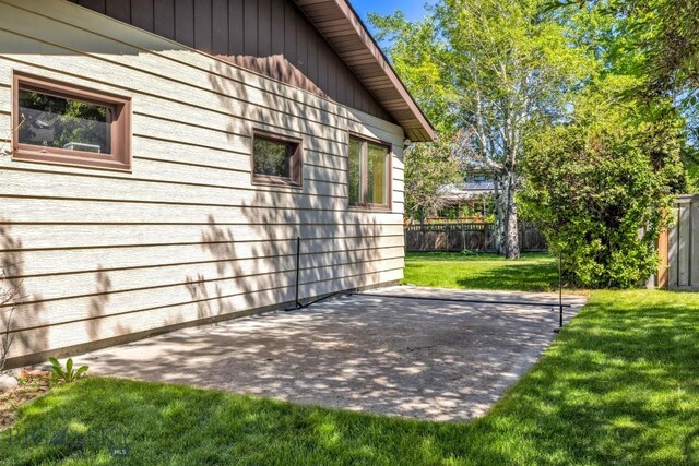 117 Henderson St, Bozeman, MT 59715 - view of side of home with a patio area