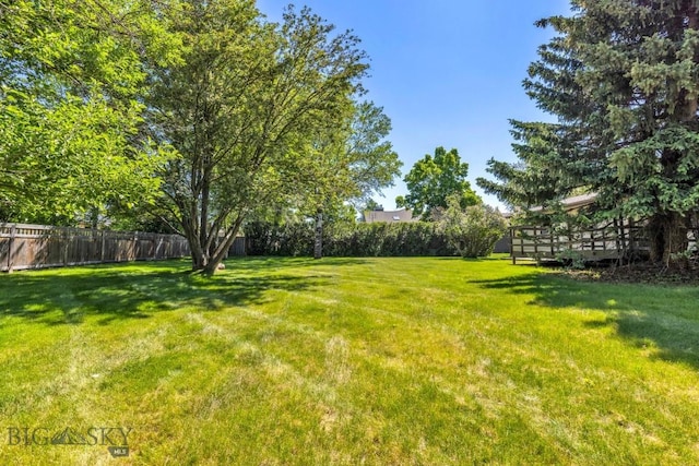 117 Henderson St, Bozeman, MT 59715 - fenced backyard featuring a deck