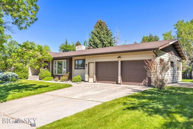 117 Henderson St, Bozeman, MT 59715 - ranch-style house with an attached garage, a chimney, a front yard, and concrete driveway