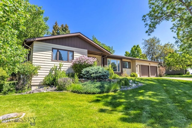 117 Henderson St, Bozeman, MT 59715 - single story home with a front yard and an attached garage