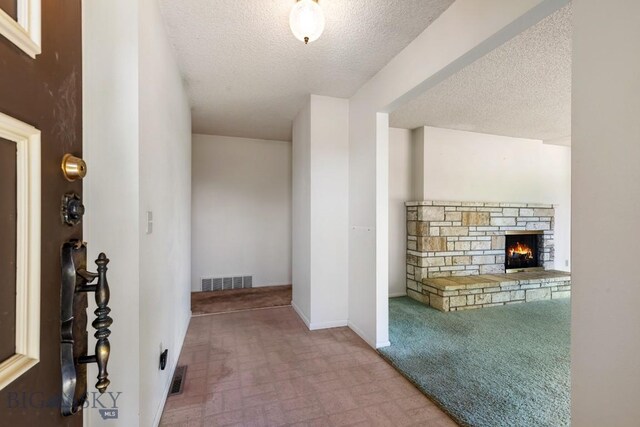 117 Henderson St, Bozeman, MT 59715 - hallway featuring a textured ceiling and baseboards