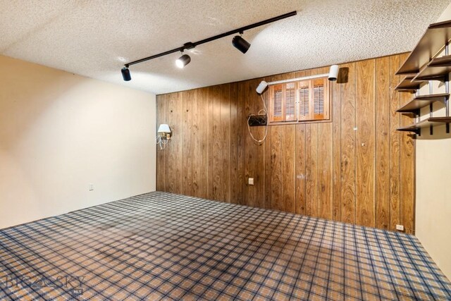 117 Henderson St, Bozeman, MT 59715 - basement featuring wood walls and a textured ceiling