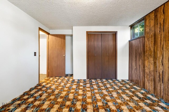 117 Henderson St, Bozeman, MT 59715 - unfurnished bedroom featuring a closet and a textured ceiling