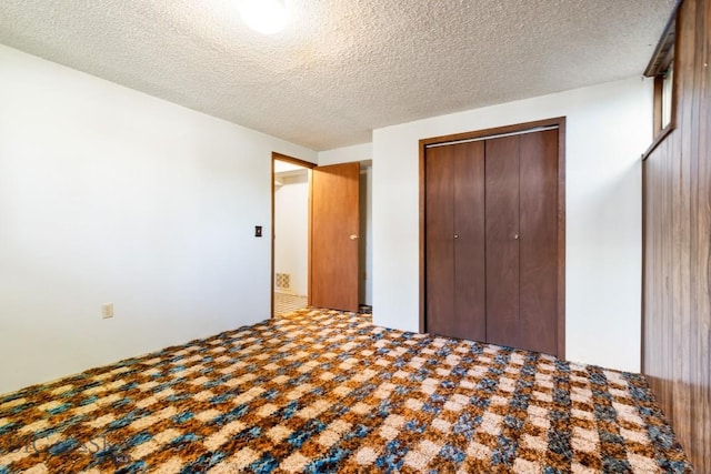117 Henderson St, Bozeman, MT 59715 - unfurnished bedroom featuring a closet and a textured ceiling