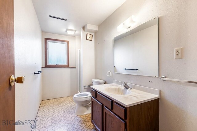 117 Henderson St, Bozeman, MT 59715 - bathroom featuring vanity, tile patterned floors, and a shower