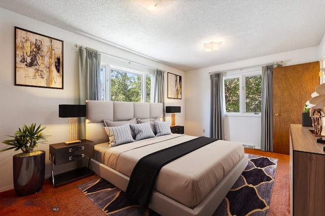 117 Henderson St, Bozeman, MT 59715 - bedroom featuring a textured ceiling and dark colored carpet