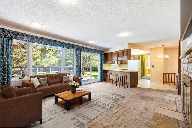 117 Henderson St, Bozeman, MT 59715 - living area with a chandelier, a textured ceiling, and light stone finish floors
