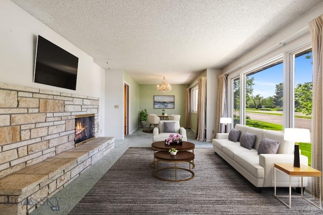 117 Henderson St, Bozeman, MT 59715 - carpeted living area featuring a textured ceiling, a stone fireplace, and a chandelier