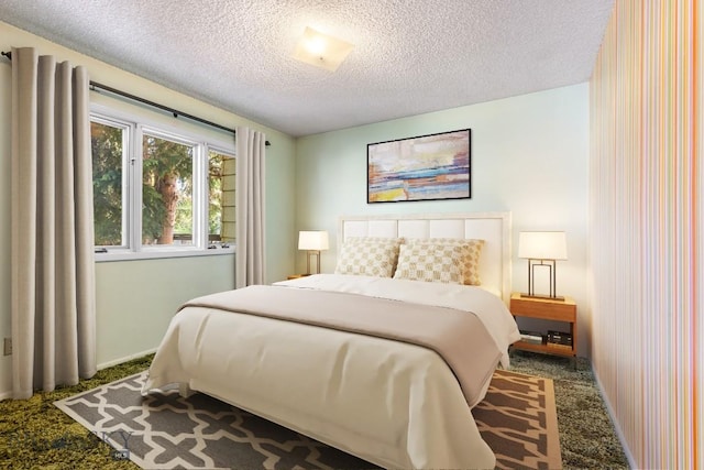 117 Henderson St, Bozeman, MT 59715 - carpeted bedroom with a textured ceiling and baseboards
